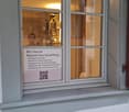 Gray double window, advertisement poster on the window