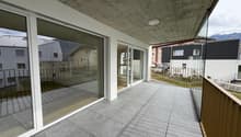 large balcony, glass walls, tiled floor, metal railings, view of mountains