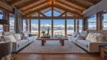 large open living space, wooden beams, large windows, sofa, coffee table, rug, table flower arrangement