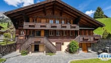 wooden chalet, 3 stories, wooden balcony, stone wall, wooden fence, garden