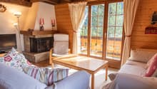 living room, fireplace, glass doors, couch, table, lamp, TV