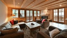 fireplace, wooden ceiling, couches, coffee table, lamps