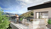 large balcony with plants, two people standing on balcony, white couches, table with flower vase, glass railing, mountain view in the distance