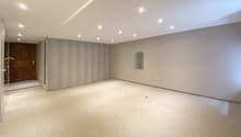 empty room, neutral color walls, carpeted floor, recessed ceiling lights, small window