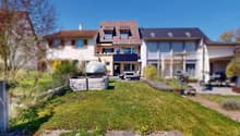 3 story house, brown roof, solar panels, terrace, garden, outdoor seating