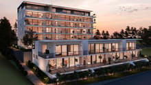 modern apartment, 5 floors, multiple balconies, large windows, outdoor seating area, green landscape