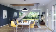Open-concept living and dining area with large windows overlooking a garden, hardwood floors, black metal and wood staircase, white dining table with yellow chairs, black pendant light fixture