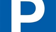 Blue sign with a white 'P' indicating a parking area.