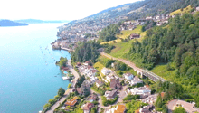 Mountain slope, houses, road, river, lake, trees, bridge, cars, swimming pool