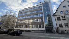 modern office building with glass windows, glass entrance, 4 parking spaces
