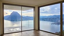 large floor to ceiling windows, wooden floor, balcony with glass railings