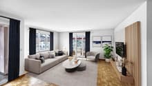 modern living room with gray couch, coffee table, armchair, TV, wooden floor, sliding glass doors to balcony