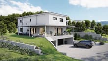 Modern two-story house, white exterior, large windows, raised ground floor, garage, outdoor seating area, landscaped garden
