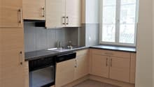 modern kitchen, tiled floor, wooden cabinets, stainless steel appliances, double sink, window