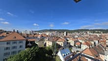 panoramic city view, buildings, hills, greenery, balconies