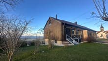 single family home, wooden exterior, brick, tiled roof, staircase, windows, outdoor garden, hilly landscape