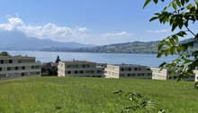 Building on a hill overlooking the lake