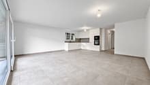 large open room, kitchen, large windows, balcony, tile flooring