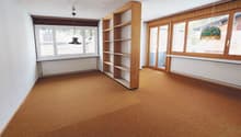 empty room, hardwood floor, large windows, a shelf, sliding door, radiators