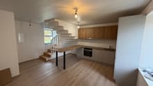 kitchen and dining area, wooden floors, kitchen island, wooden staircase, cabinets, sink, oven