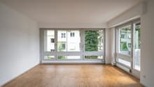 empty room, wooden floor, large windows, balcony, white walls, white ceiling