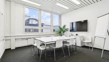 modern office room, white walls, large windows, white table, white chairs, whiteboard, TV, plant