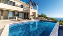 Modern villa, large windows, outdoor seating, pool, wooden pergola, large terrace