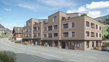 Multi-story residential building, modern design, multiple windows, rooftop terrace, street front, greenery