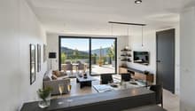 open space with living and dining area, large windows, grey sofa, coffee table, TV