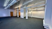 empty room, white walls, gray carpet, metal ceiling, wooden doors