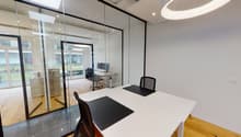 modern office room, glass walls, white desk, black chairs, computer, wooden floor