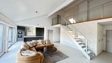 modern design, white tiles, large couch, coffee table, glass staircase, glass doors