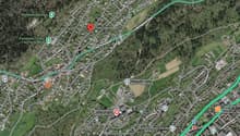 Aerial map of a town with roads, buildings, and landmarks