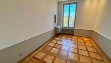 empty room, wooden parquet floor, white walls, window, radiator, sink, mirror