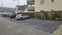 two cars parked, concrete ground, street, hedges