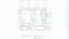 The image shows a floor plan with various rooms and spaces labeled. The main rooms visible include a living room, kitchen, and bedrooms.