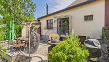 House with a terrace, outdoor dining area, barbecue, and a covered patio.