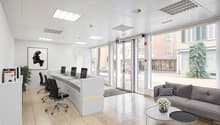 modern office with white walls, beige tiles, large windows, reception desk, office chairs, couch, coffee table, flower vase