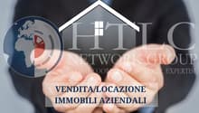 Advertisement poster for HTIC NETWORK GROUP showcasing global coordination and local expertise for selling and leasing properties.