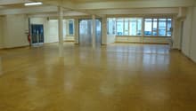 wooden floor, multiple windows, pillars, fire extinguisher