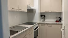 modern kitchen with granite countertops, stainless steel sink, electric stove, oven, and dishwasher