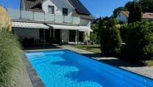 modern single family house, white walls, gray roof, solar panels, swimming pool, garden, motorcycle