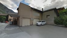 3 story house, beige exterior, double garage, driveway, white car parked