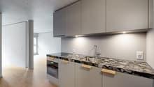 modern open kitchen with marble countertop, stainless steel sink, wooden cabinets, built-in dishwasher