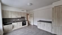 empty kitchen with cabinets, stove, sink, dishwasher, and counter with modern appliances
