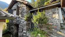 Stone house, wooden roof, wooden door, garden, mountain view