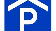 blue sign indicating parking area with a house icon on it