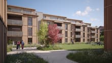 3 story building, wooden facade, balconies, common outdoor space