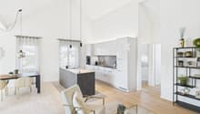 modern kitchen with island, dining table, living room with armchair, coffee table, shelves, wooden floor