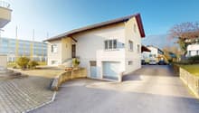 2 story house, white walls, brown roof, driveway, garage, staircase